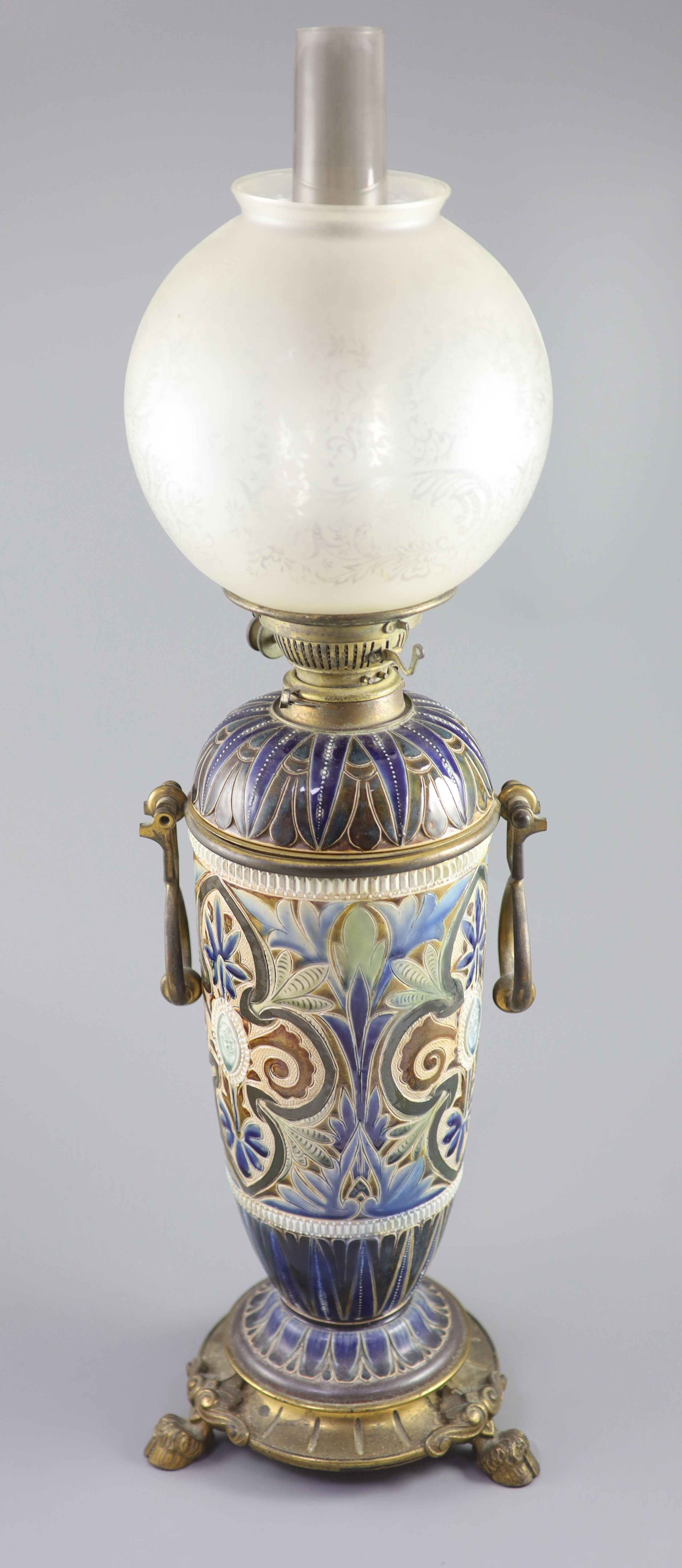 A large Doulton Lambeth stoneware oil lamp, by Edith D. Lupton, dated 1880, 50.5cm high excluding glass chimney and shade